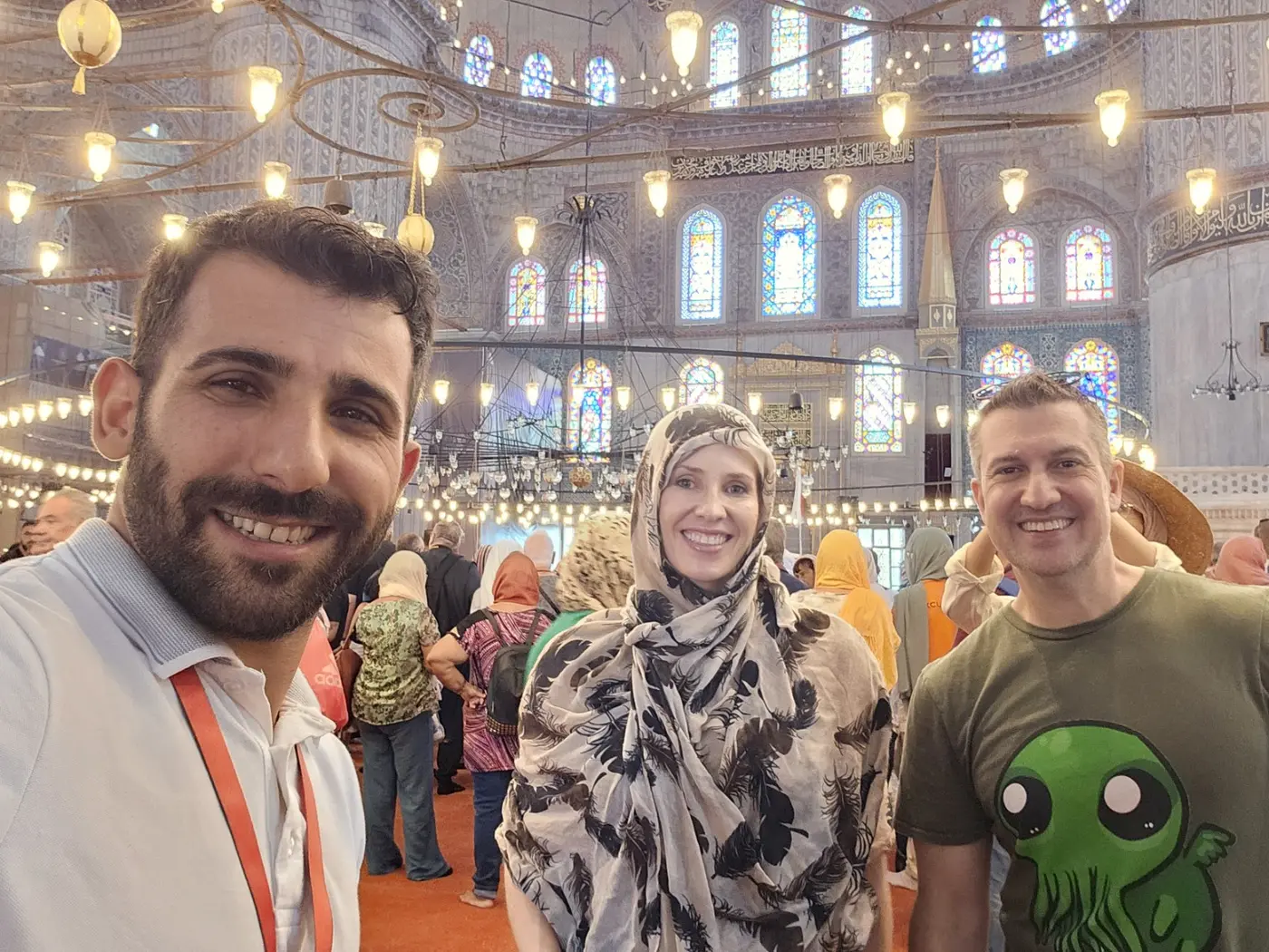 Licensed Istanbul guide Aydın with private guests inside the Blue Mosque